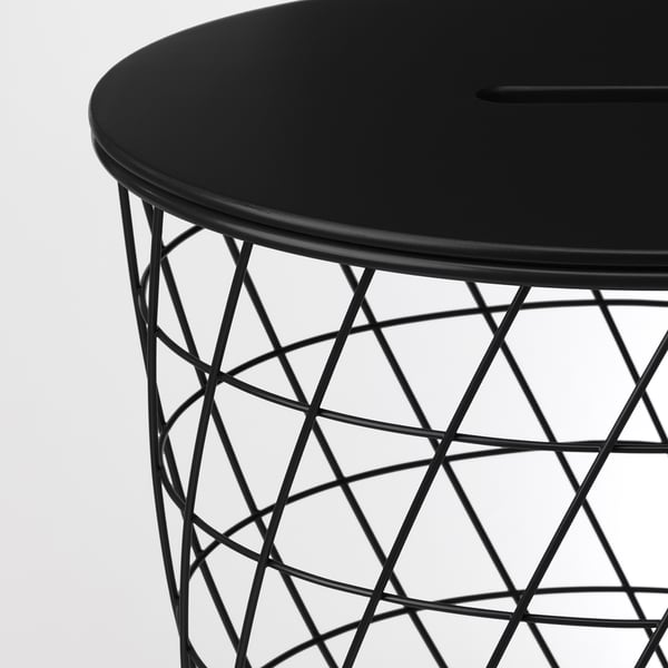 Modern black side table with sleek round top and intricate wire base, offering stylish storage.