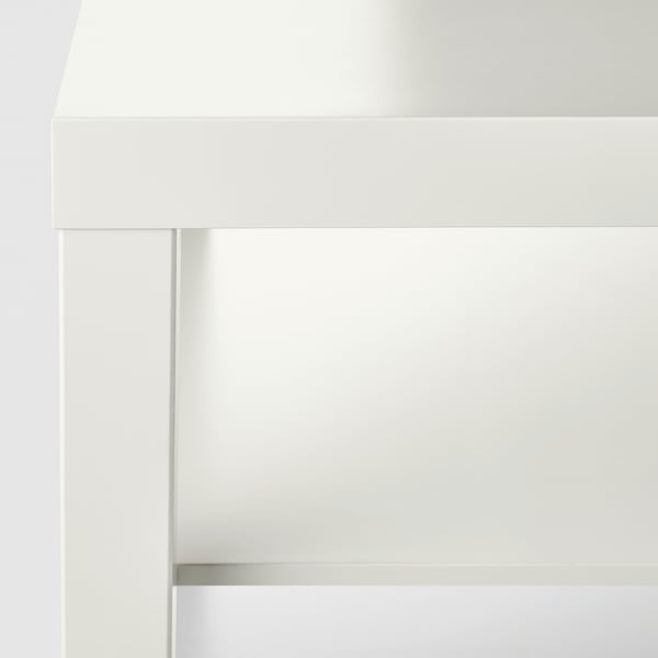 Modern, crisp white desk with clean lines and smooth surfaces, part of ikeas LACK series.