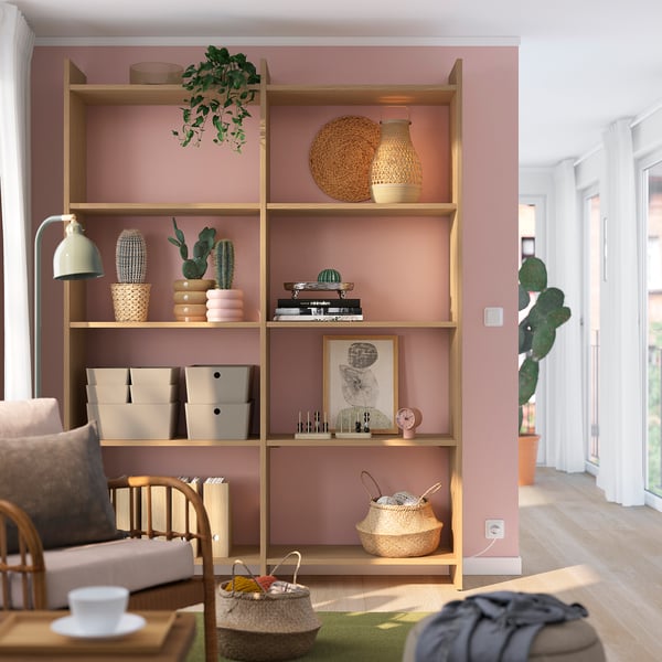 Modern living room with LÅDMAKARE storage, open shelves, closed storage, cushioned chair, and decor.