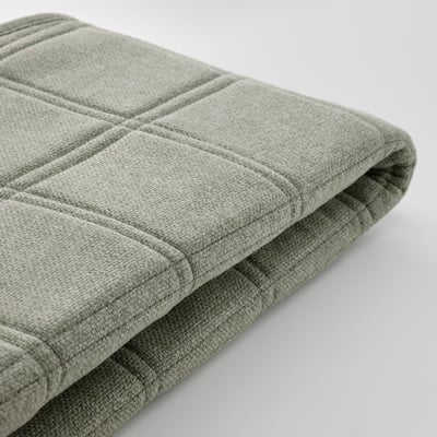 Folded grey fabric, soft texture, neat stitching, recycled material.