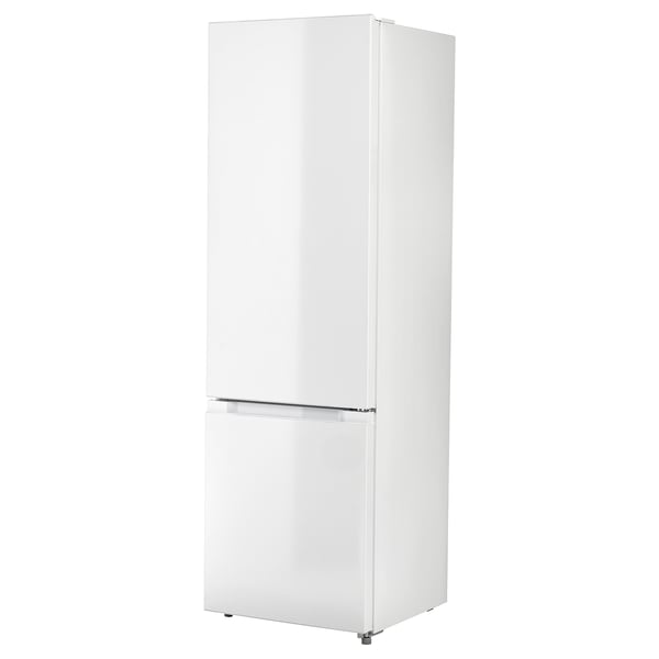 White upright fridge-freezer with seamless design and transparent drawer at the bottom.