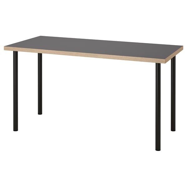 LAGKAPTEN desk shown, grey top, black metal legs, rectangular.