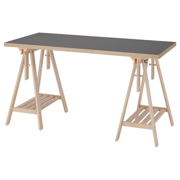LAGKAPTEN: gray rectangular desk with light wood trestles. Tiltable top, sturdy design.
