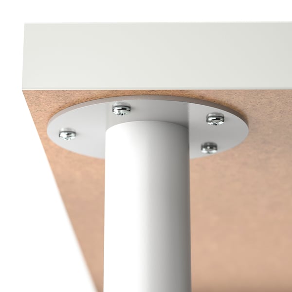 Image shows a sturdy table joint; metal screws secure top to leg.