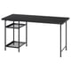LAGKAPTEN desk in black with mesh shelves.