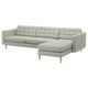 A modern, light grey l-shaped sofa named LANDSKRONA. It has tufted cushions, stainless legs, and a cosy, stylish design.