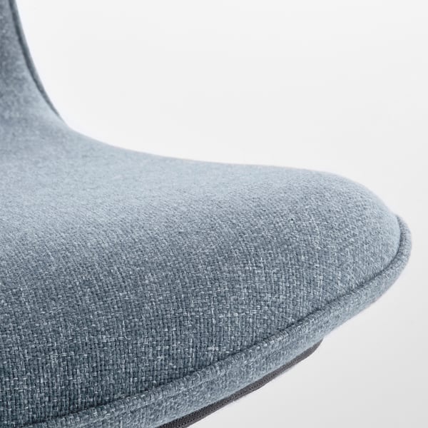 Close-up of a modern, ergonomic chairs seat and backrest. Soft, grey fabric covers comfortable, curved surfaces, emphasising quality craftsmanship.