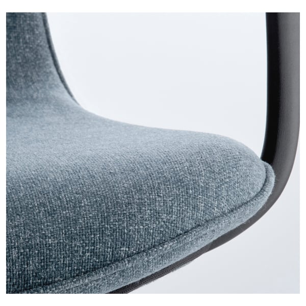 Close-up of a modern office chairs cushioned seat and armrest. Soft blue fabric, stylish design.