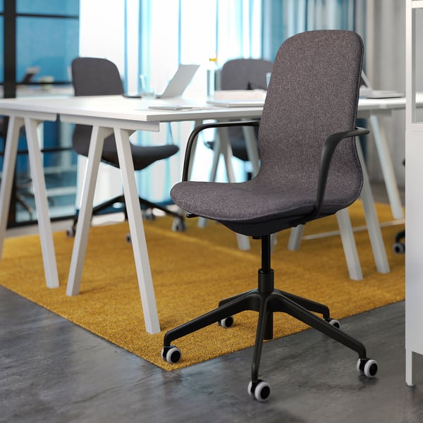 Modern office chair, grey, fabric, black wheels, ergonomic design.
