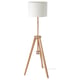 A wooden tripod floor lamp called LAUTERS with a white recycled shade.