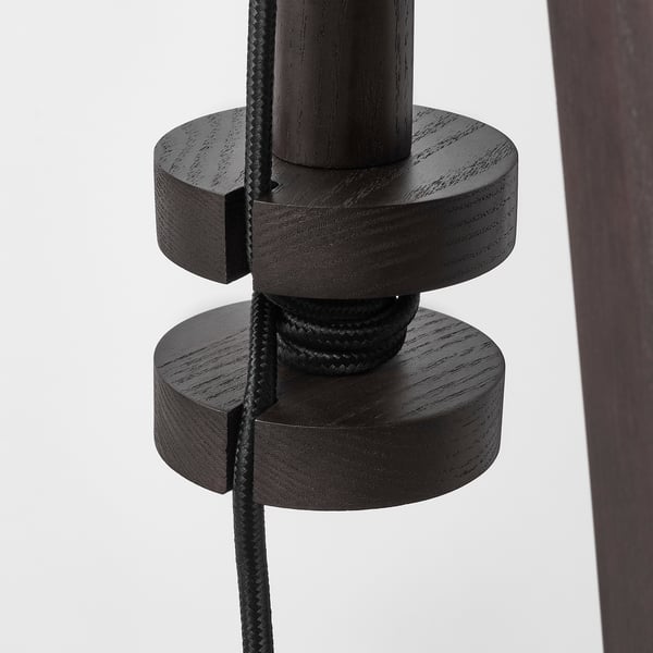 Black lamp base with braided cord, adjustable design. Wooden parts show quality craftsmanship.