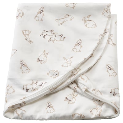 This image shows a white baby blanket with beige rabbit prints, featuring soft, sustainable cotton material.
