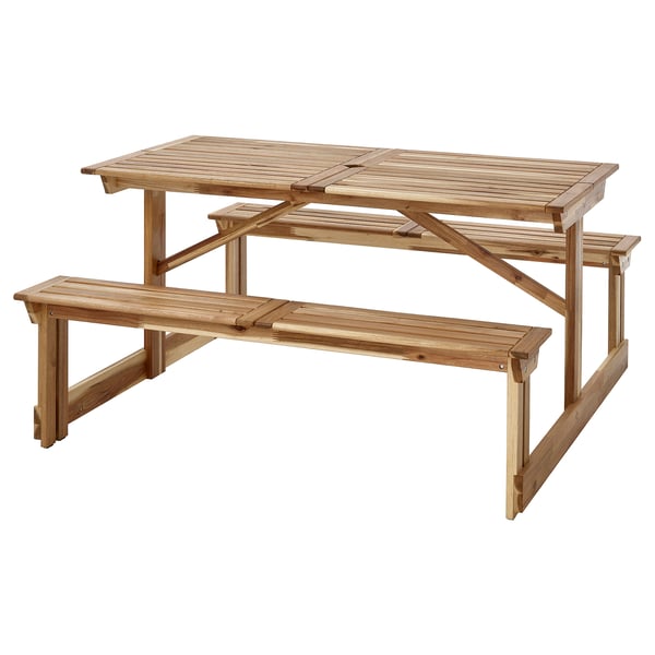 A wooden picnic table named LERHOLMEN, made from acacia, designed for outdoor use, with a hole for a parasol, seating up to 6.