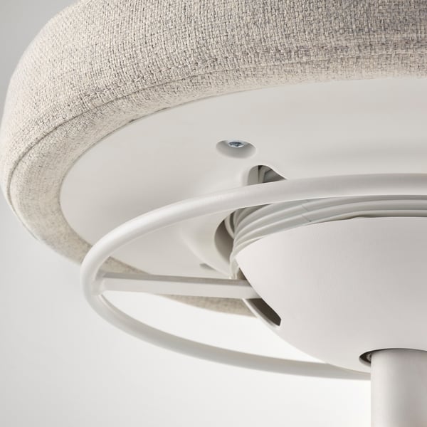 Close-up of LIDKULLENs sleek, modern design. Shows white metal base and fabric-covered seat, highlighting quality materials.