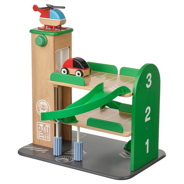 LILLABO green wooden toy garage with red car, blue cylinder, and helicopter, featuring ramps and numbered levels.