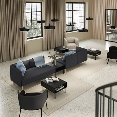 Modern living room with LILLEHEM sofa in grey, black coffee tables, beige curtains, and black pendant lights.