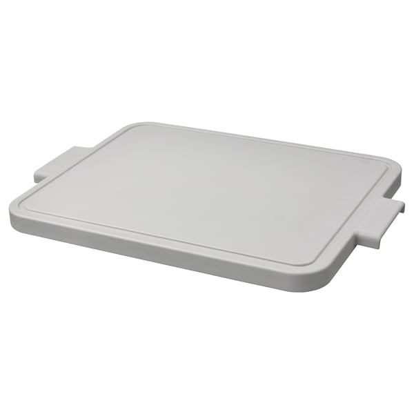 The LILLHAVET chopping board in light grey, made of polyethylene plastic, with a rectangular shape and four silicone rubber feet for stability.
