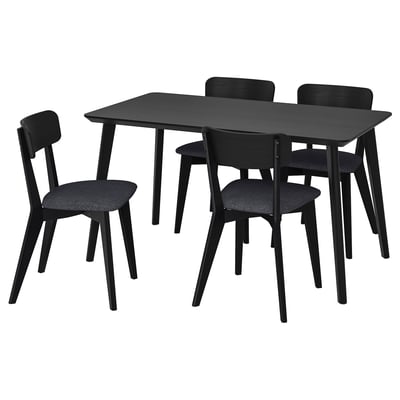Modern black dining set with rectangular table and four padded chairs. Simple, sleek design; perfect for small spaces.