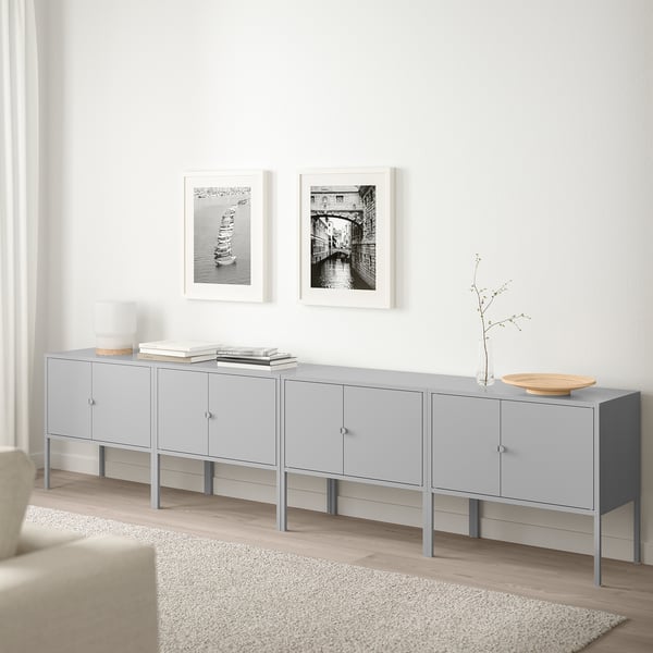 Grey LIXHULT storage cabinet with multiple compartments, displayed in minimalist space.