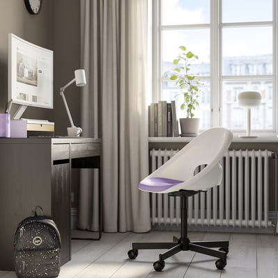 Modern home office: LOBERGET chair, desk, monitor, lamp, plant, backpack, window.