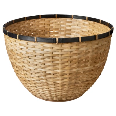 A hand-woven LÖVRÄFSA basket, light brown, with dark brown trim, made of bamboo, round and shallow.