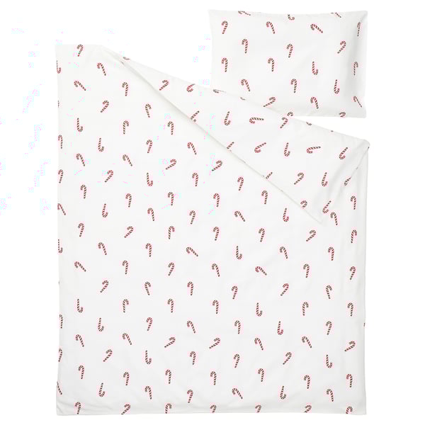 A white bedding set with red candy cane print, made of cotton. Includes a duvet cover and a pillowcase, perfect for holiday decor.
