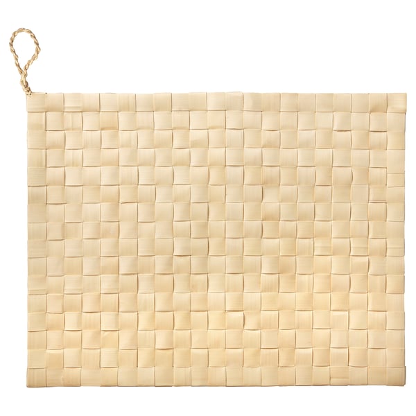 Natural beige woven palm place mat with loop handle, handcrafted for rustic charm.