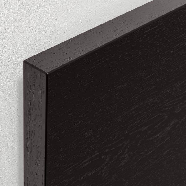 Dark wood corner with visible grain texture, smooth finish, showcasing high-quality craftsmanship.