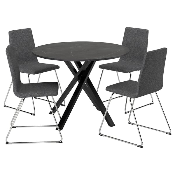 A black round dining table with a metallic base and four matching chairs. The chairs have grey upholstered seats and backs with metal legs.