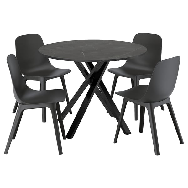 Black marble dining table with 4 matching chairs.