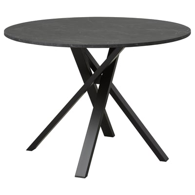 A sleek, black MARIEDAMM dining table with a circular marble top and sturdy, crisscross metal legs.