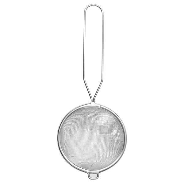A MEDARBETARE stainless steel strainer with a long handle, designed to fit various bowl and mug sizes.