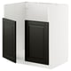 METOD kitchen unit with black beveled doors.