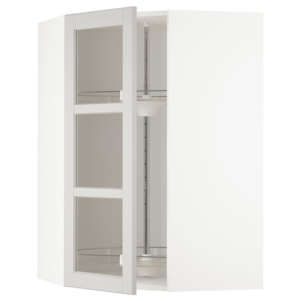Open white corner kitchen unit with glass doors, adjustable shelves inside, modern design.