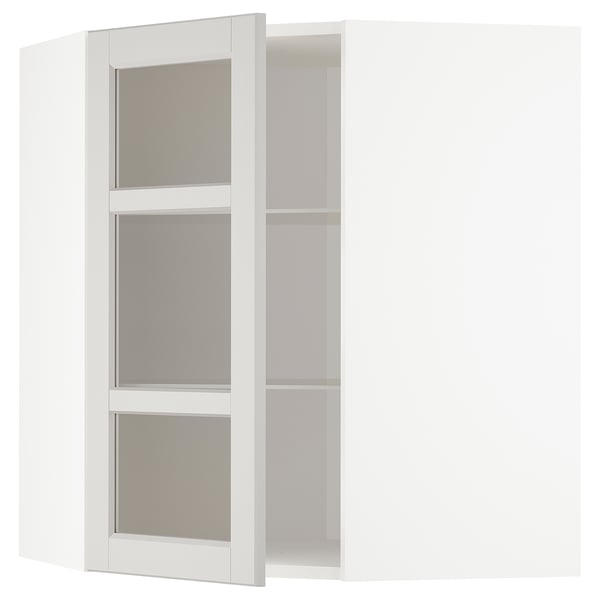 White METOD kitchen cabinet with three adjustable shelves and frosted glass doors.