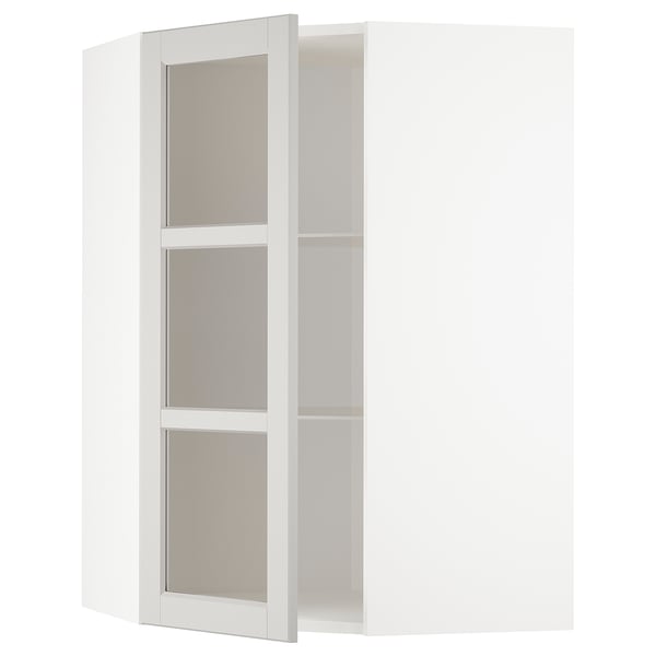 White METOD corner cabinet with adjustable shelves.