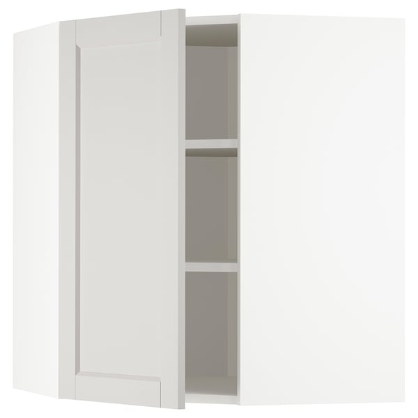 Open white kitchen cabinet with 3 shelves.