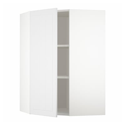 A white METOD kitchen corner cabinet with adjustable shelves and reversible doors.