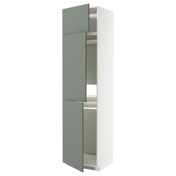 A white and green ikea METOD kitchen cabinet with two doors. Its tall, rectangular, and has a modern design.