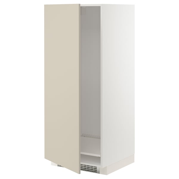 A beige METOD cabinet from ikea. Its a tall, rectangular unit designed for a fridge or oven, featuring a smooth, clean look with adjustable shelving.