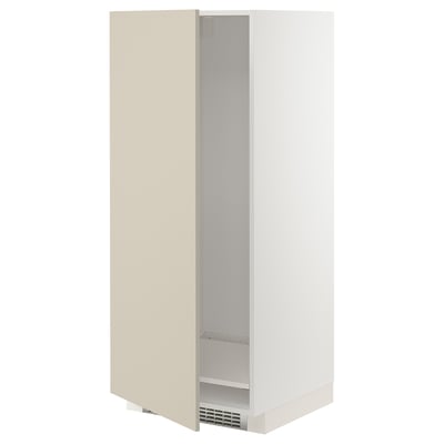 A beige METOD cabinet from ikea. Its a tall, rectangular unit designed for a fridge or oven, featuring a smooth, clean look with adjustable shelving.