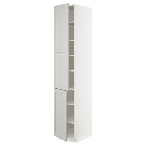 This image shows a tall, white METOD kitchen cabinet with a classic, traditional design. It two doors and adjustable shelves inside.