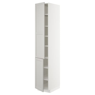 This image shows a tall, white METOD kitchen cabinet with a classic, traditional design. It two doors and adjustable shelves inside.