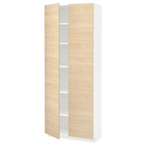 A white and light wood-colored tall cabinet with adjustable shelves, part of the METOD kitchen system.