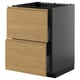 Modern kitchen unit with two oak drawers and black base.