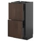Dark brown kitchen cabinet with wooden doors and metal hinge.