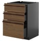 Modern dark brown stained ash kitchen cabinet with three wooden drawers and metal handles.