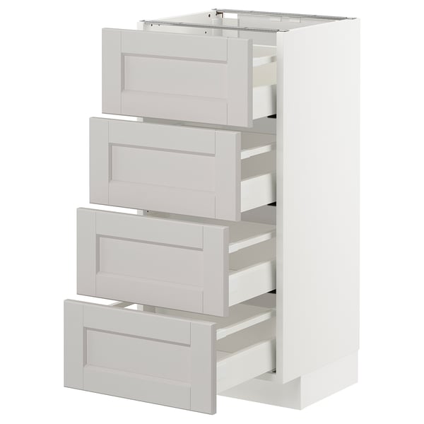 White METOD kitchen cabinet with 3 grey drawers.