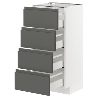 White METOD kitchen unit with four grey drawers, modern minimalist design.