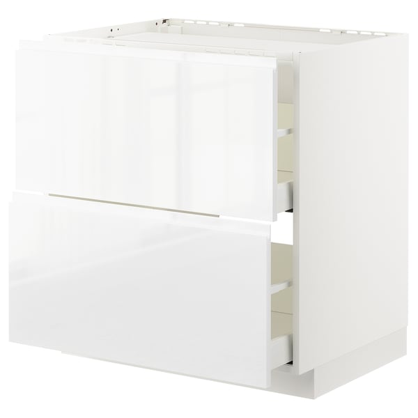 White glossy kitchen cabinet, METOD series, with integrated handles and smooth wooden appearance.